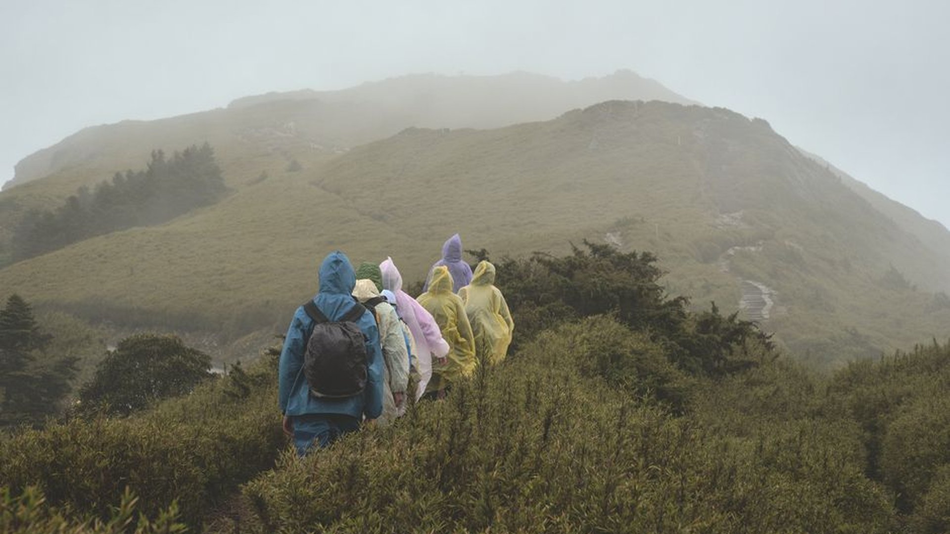 mountain summit rain hiker backpack trail weather