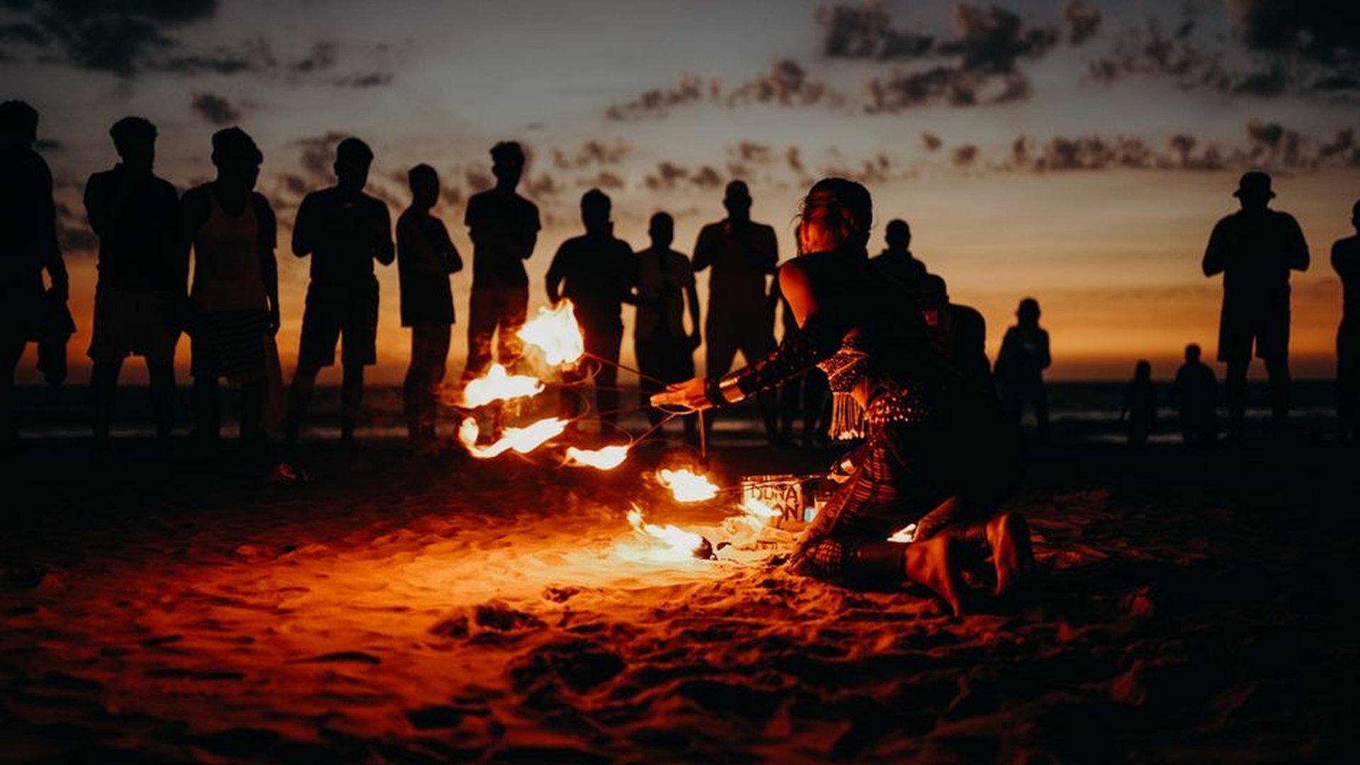 beach sunrise Polynesian ceremony drumming fire da
