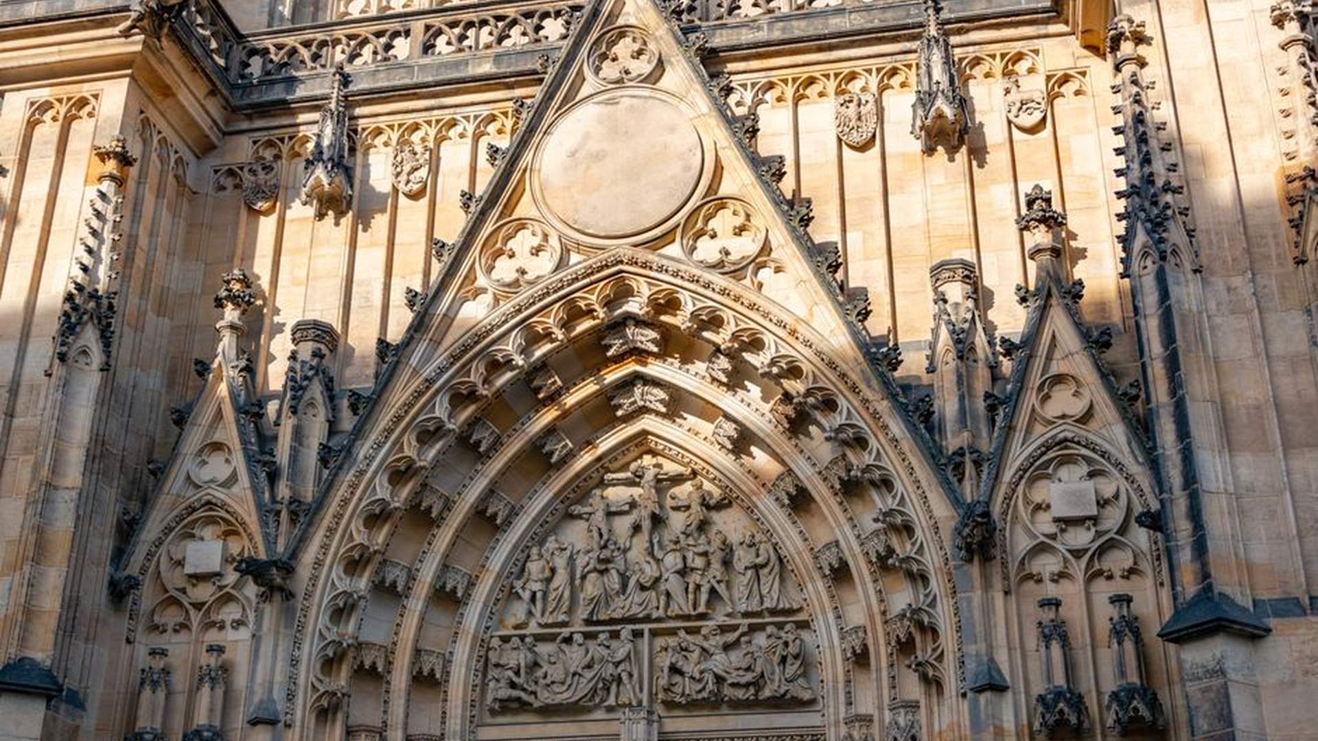 Prague Main Station exit stone archway church spir