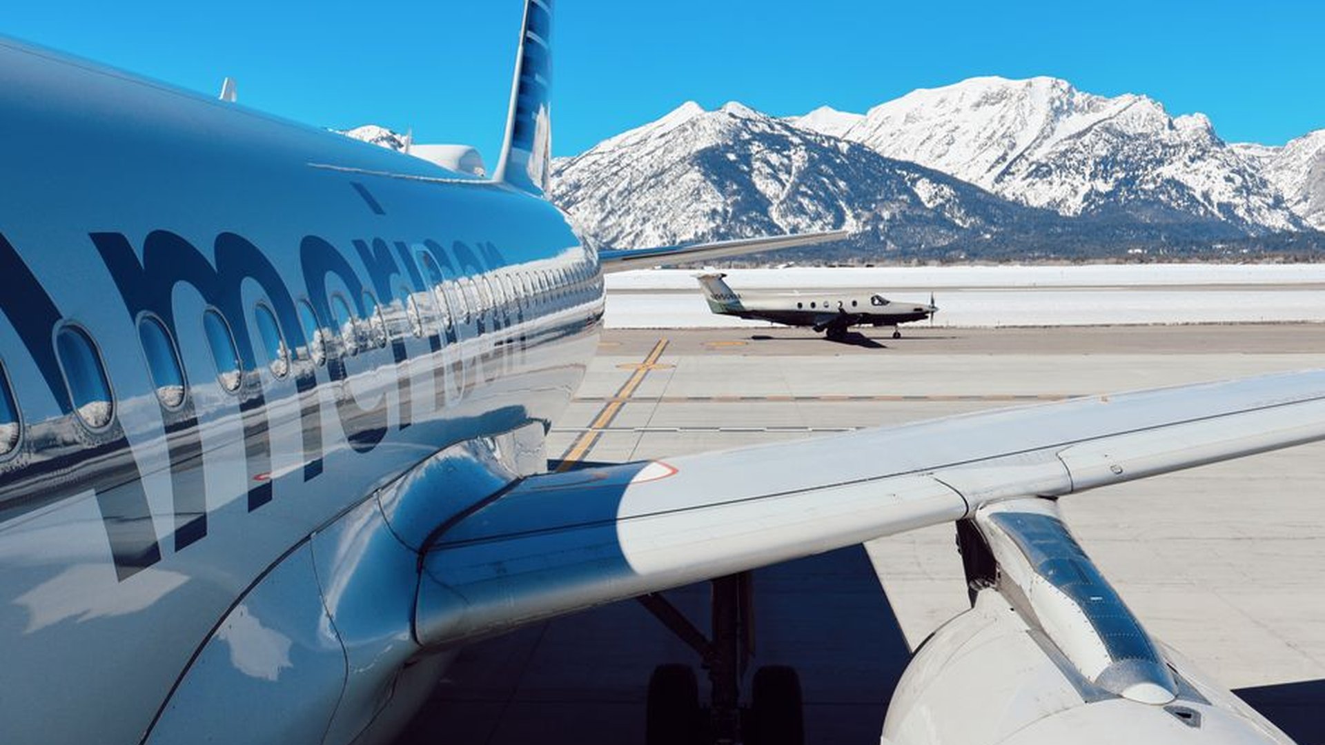 snowy mountains airport runway winter storm flight