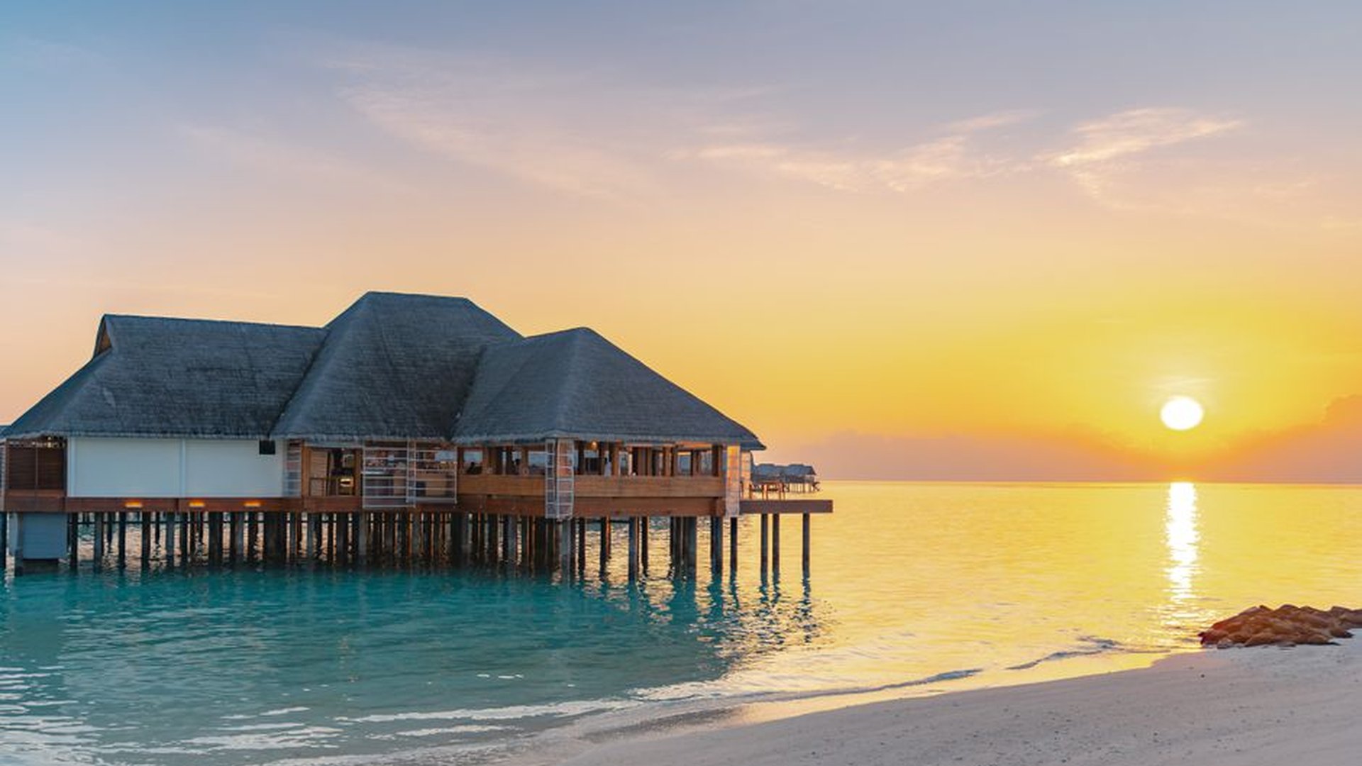 Maldives overwater bungalow white sand beach turqu