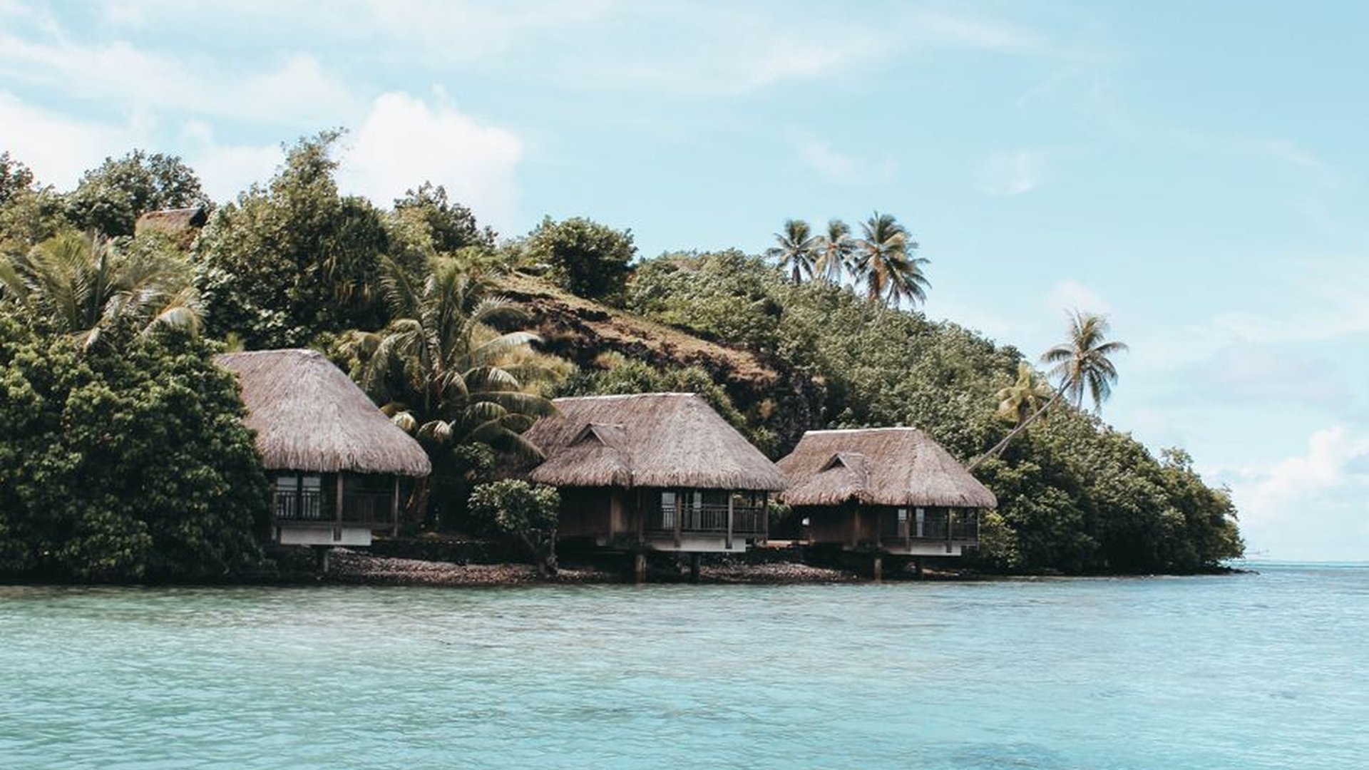 overwater bungalow Bora Bora lagoon turquoise wate