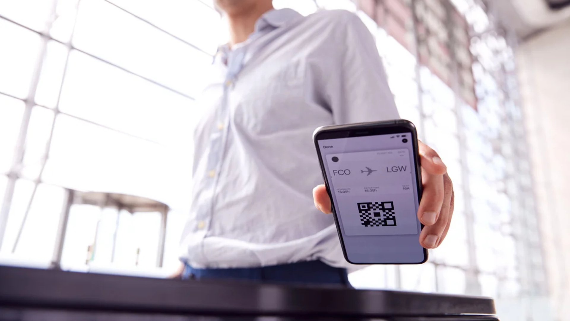 airport gate passenger boarding pass hand scanning